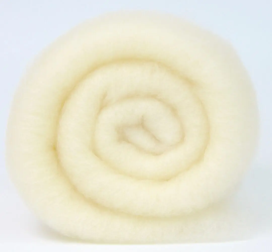 A soft, cream-colored wool roll.