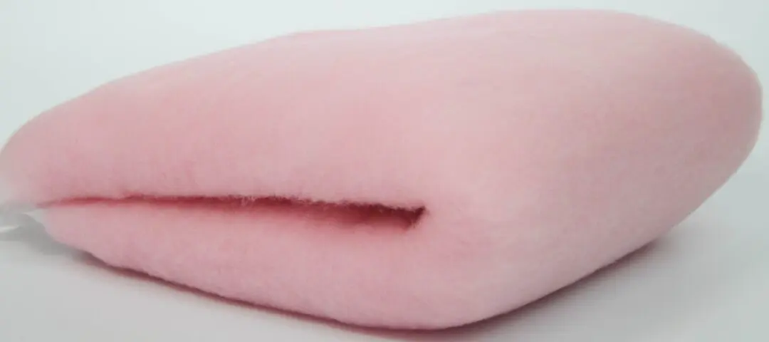 Soft pink fleece fabric folded neatly.